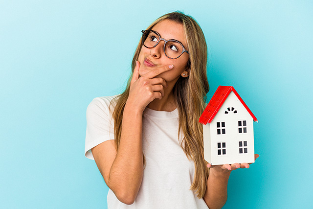 Young lady dreaming about new home